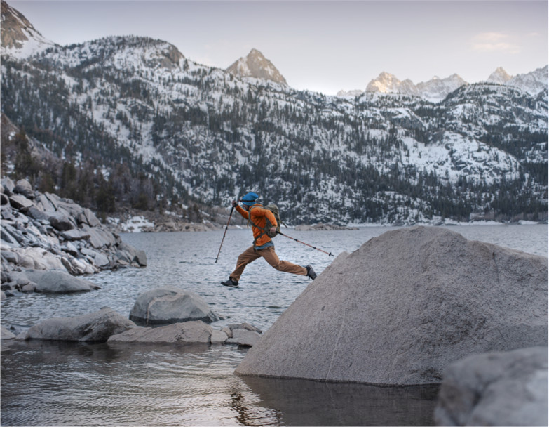 Mountainsmith hiker leaping over rocks